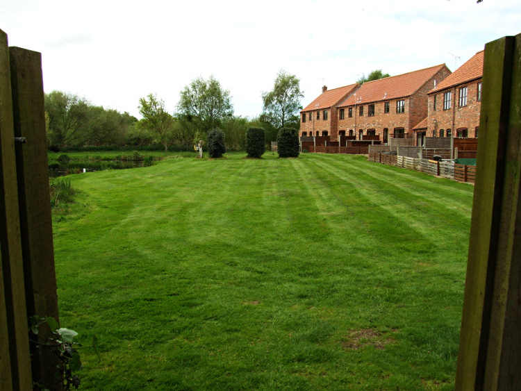 Communal Grounds Behind The
		Cottages